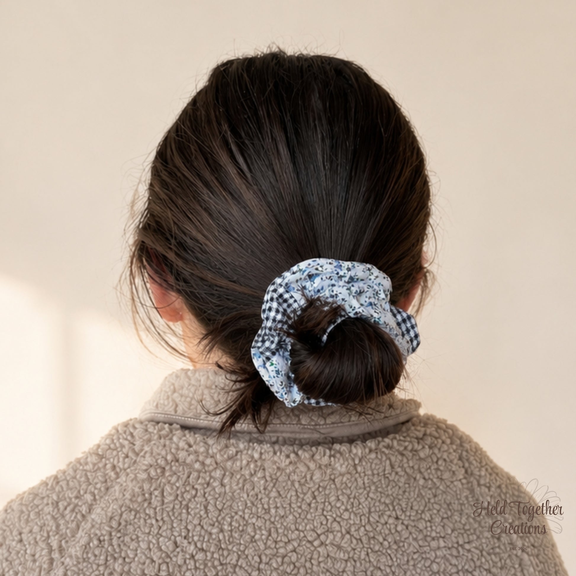 Handmade Checked Bloom Scrunchie with blue floral fabric and navy check fabric on a warm ivory background.