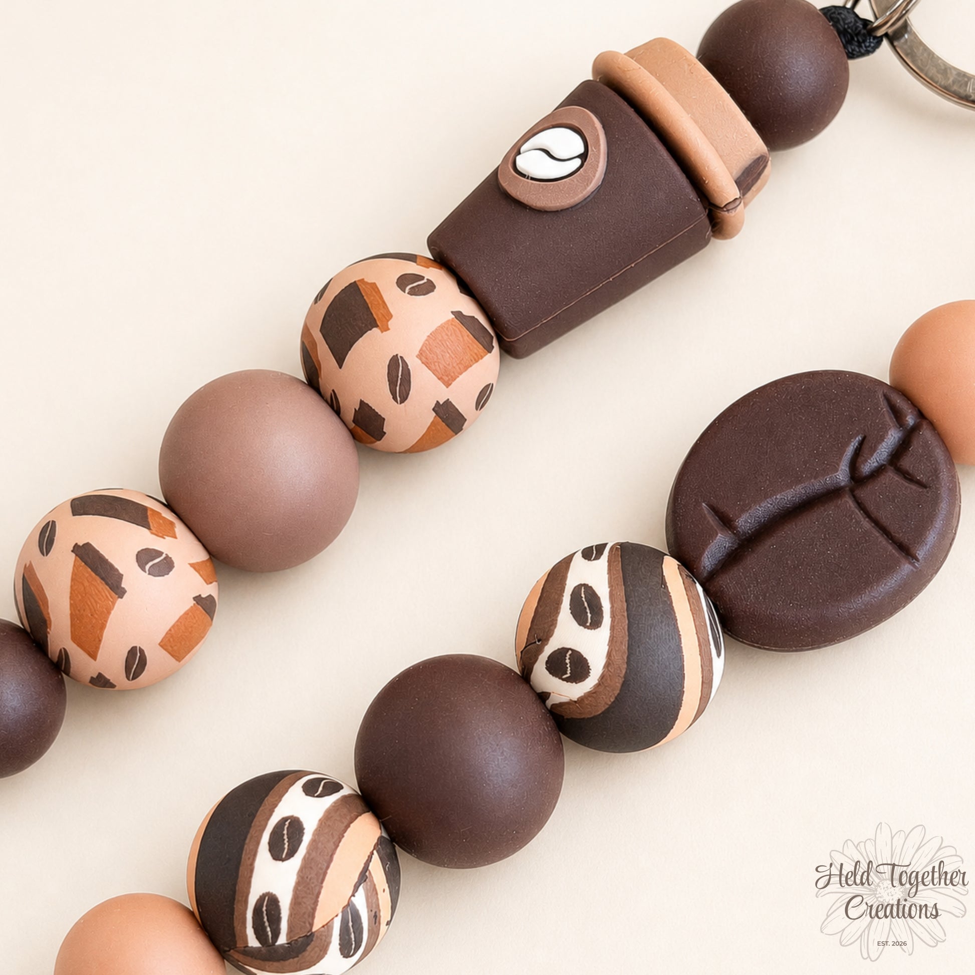 Handmade coffee lover silicone bead keyrings in Coffee Cup and Coffee Bean styles with brown, mocha, cream and latte-toned beads.