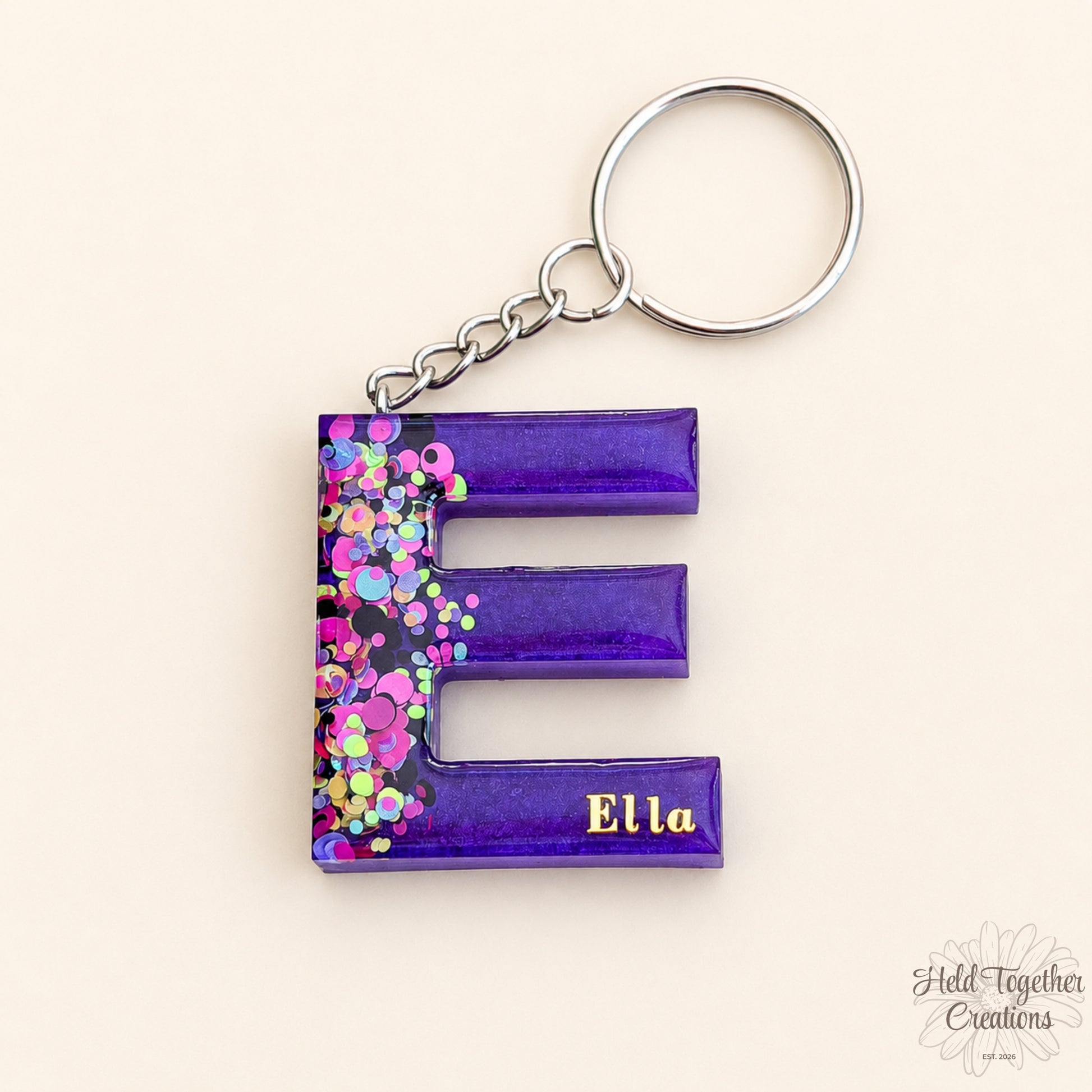 Keychain with letter 'E' and colorful design on a white background