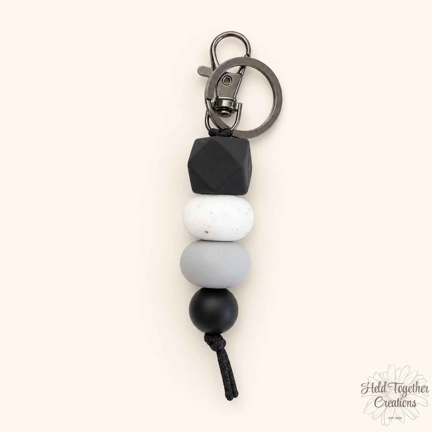 Dark and Stormy handmade silicone bead keyrings in black, grey, white and speckled beads with metal keyring hardware.