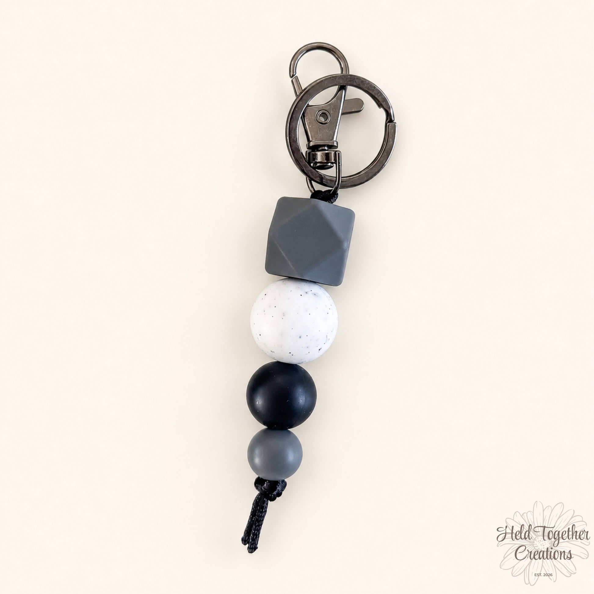 Keychain with geometric beads on a white background
