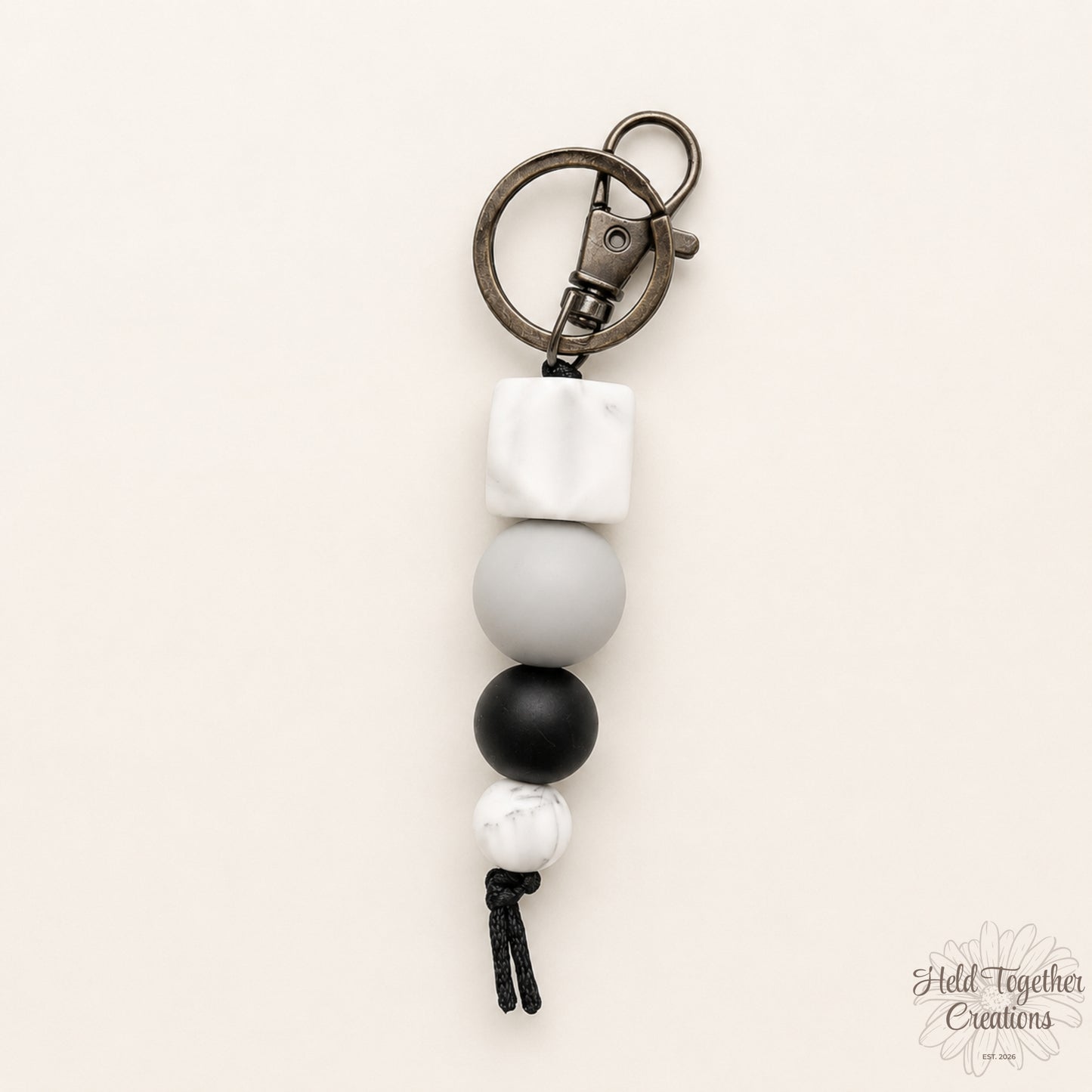 Keychain with beads on a beige background
