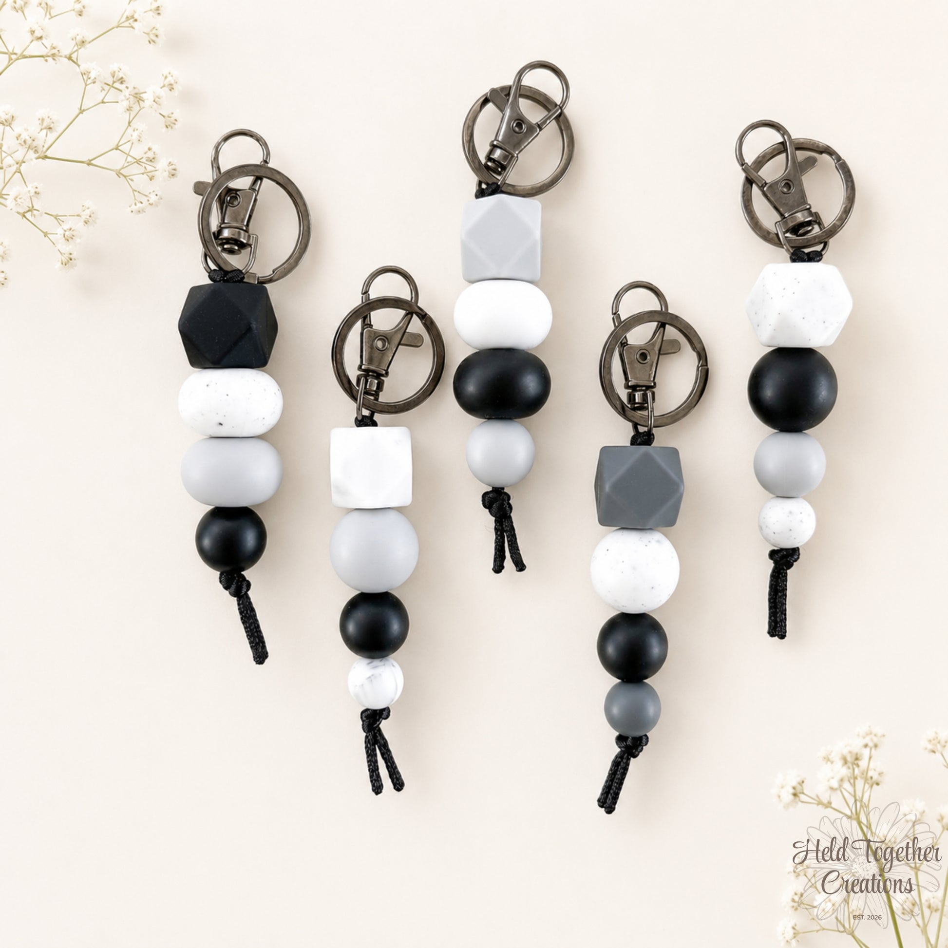 Dark and Stormy handmade silicone bead keyrings in black, grey, white and speckled beads with metal keyring hardware.
