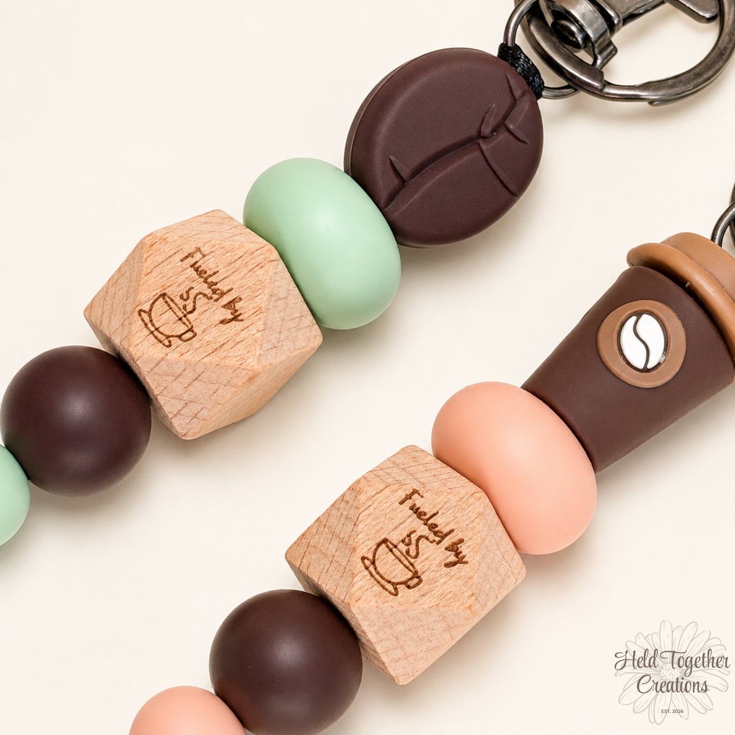 Close-up of a keychain with wooden and silicone beads on a light background