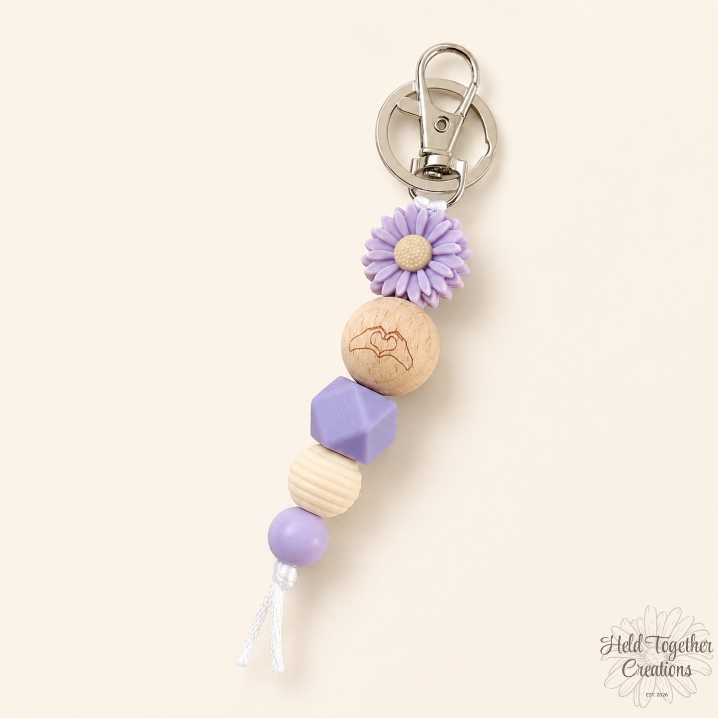 Pink and purple handmade Heart Hands silicone bead keyrings with daisy beads and silver keyring hardware.