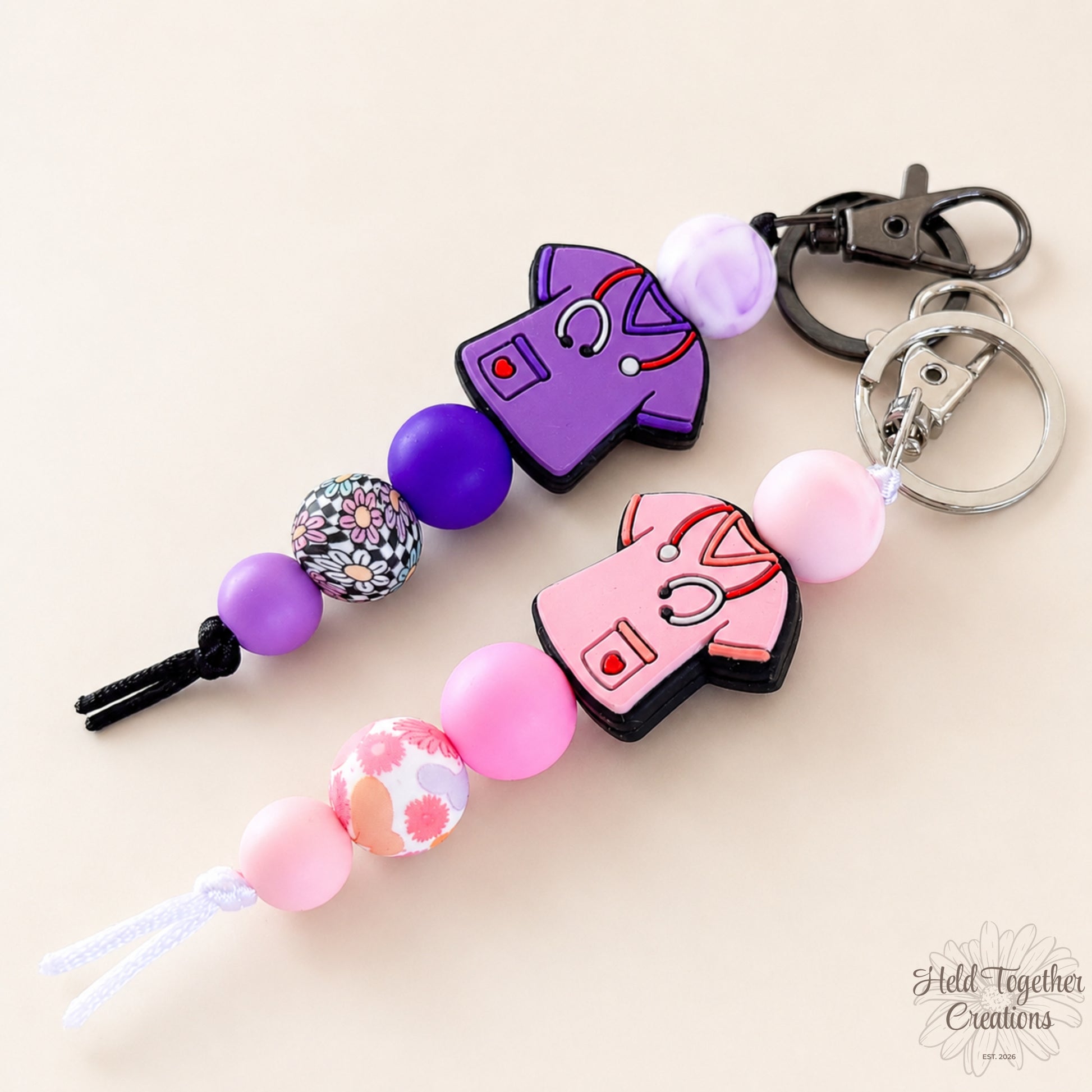 Keychain with colorful beads and character charms on a beige background