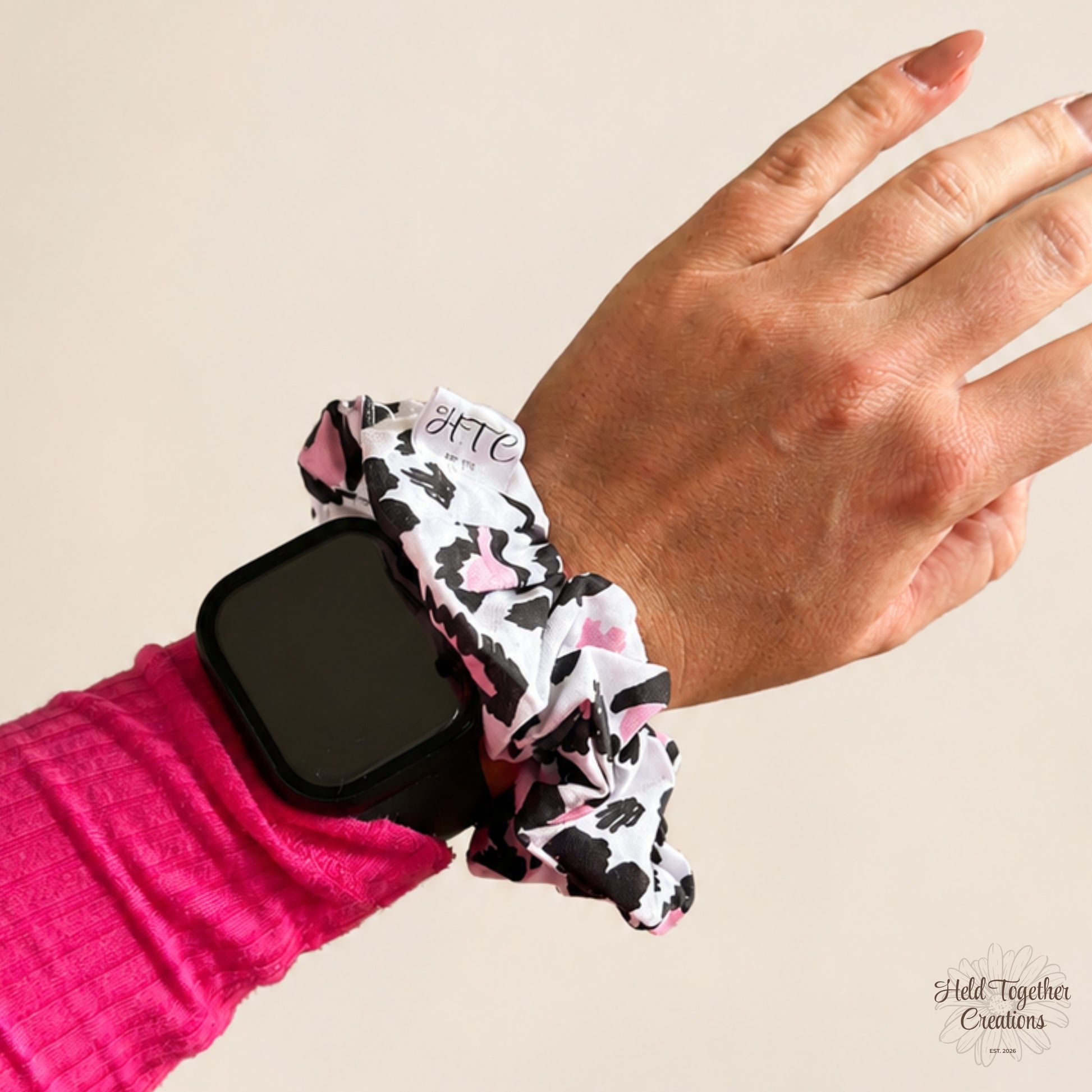 Leopard Love Scrunchie worn on the wrist beside an Apple Watch, showing size and everyday styling.