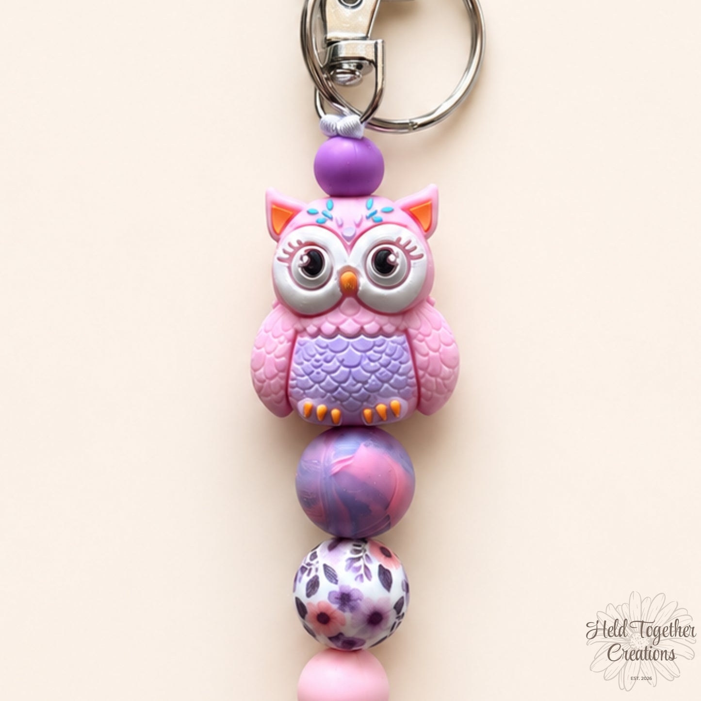 Purple owl silicone bead keyrings with pink, purple and patterned beads on silver keyring hardware.