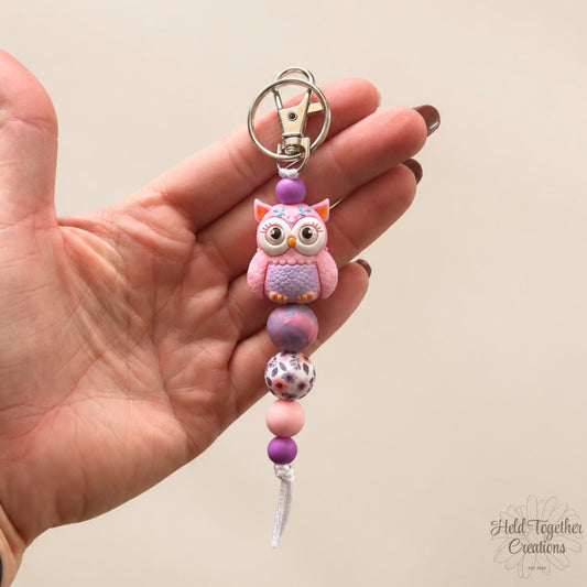 Purple owl silicone bead keyrings with pink, purple and patterned beads on silver keyring hardware.