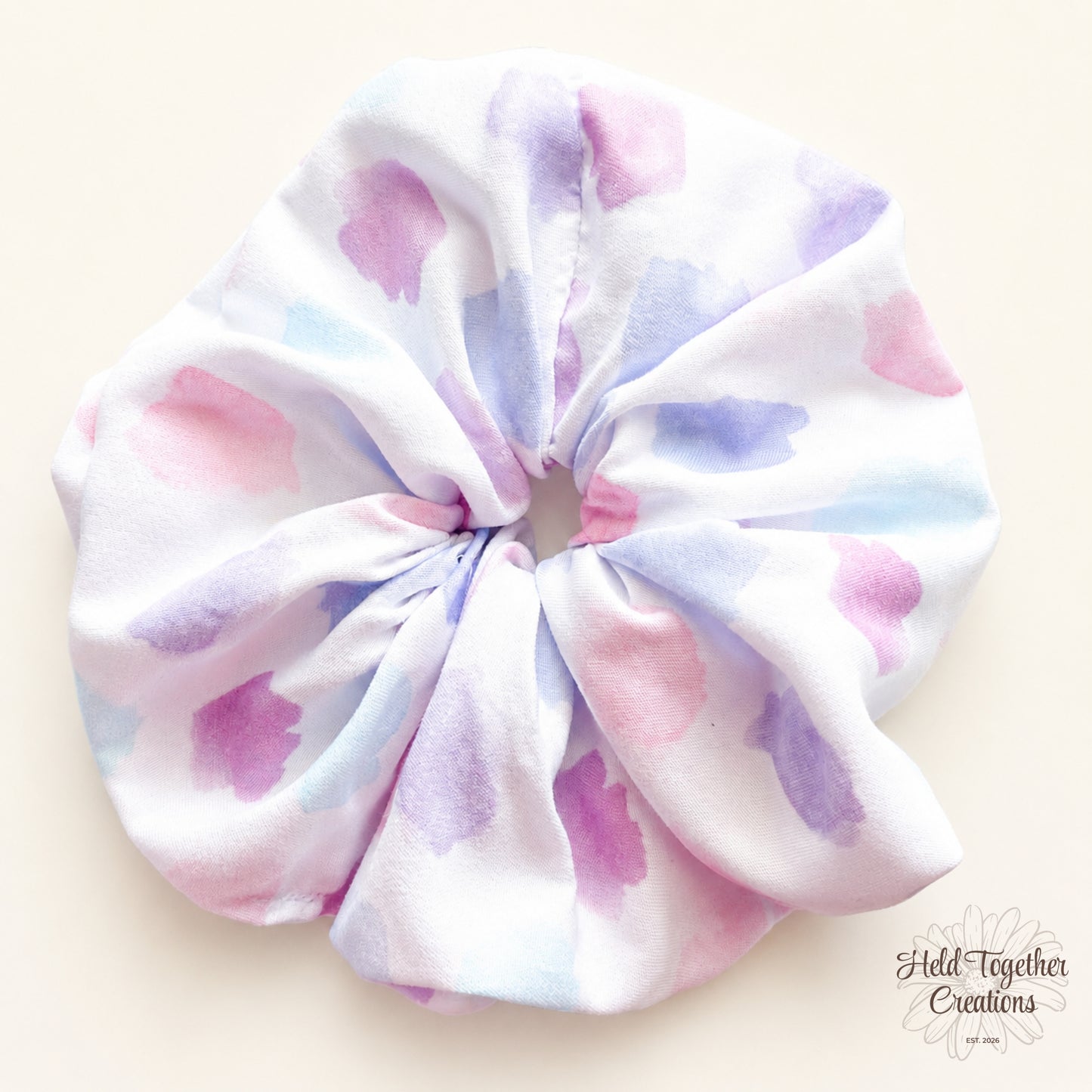 Pastel Spot Scrunchie with white fabric and soft pink, purple and blue pastel spot print.