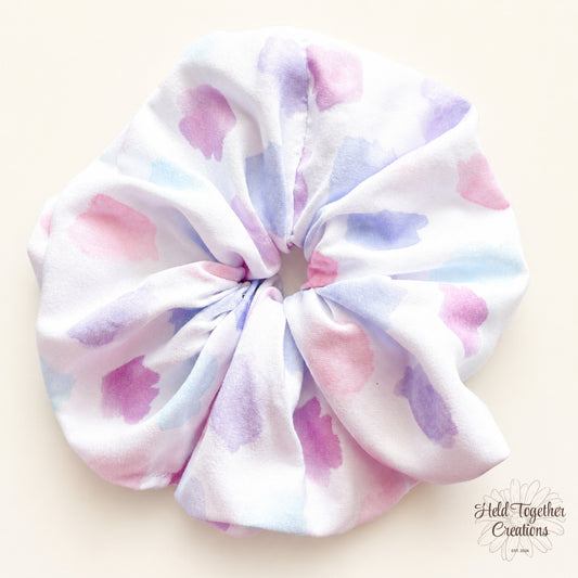 Pastel Spot Scrunchie with white fabric and soft pink, purple and blue pastel spot print.