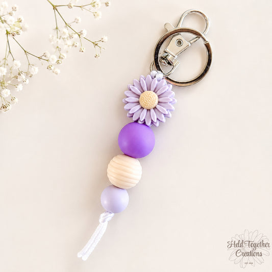 Purple silicone bead daisy keyring.